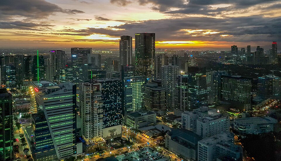 Taguig skyline at sunset from Grand Hyatt — condos and homes overlooking Bonifacio Global City